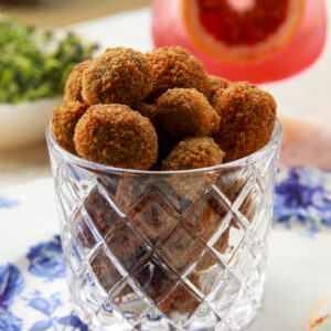 Crispy feta stuffed fried olives served with garlicky yogurt and paprika butter