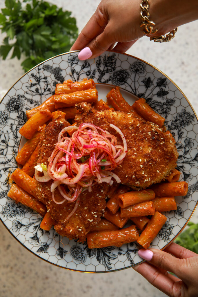 buldak carbonara pasta with crispy chicken and pickled onions