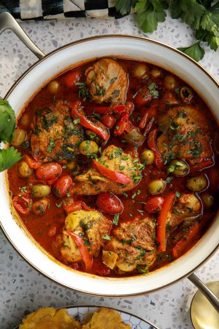 Panamanian-style pollo guisado with tender chicken, peppers, and olives in rich tomato sauce