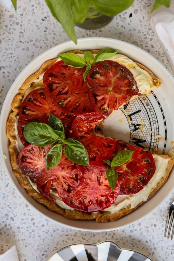 Whipped Brie heirloom tomato tart topped with fresh basil and brown butter hot honey